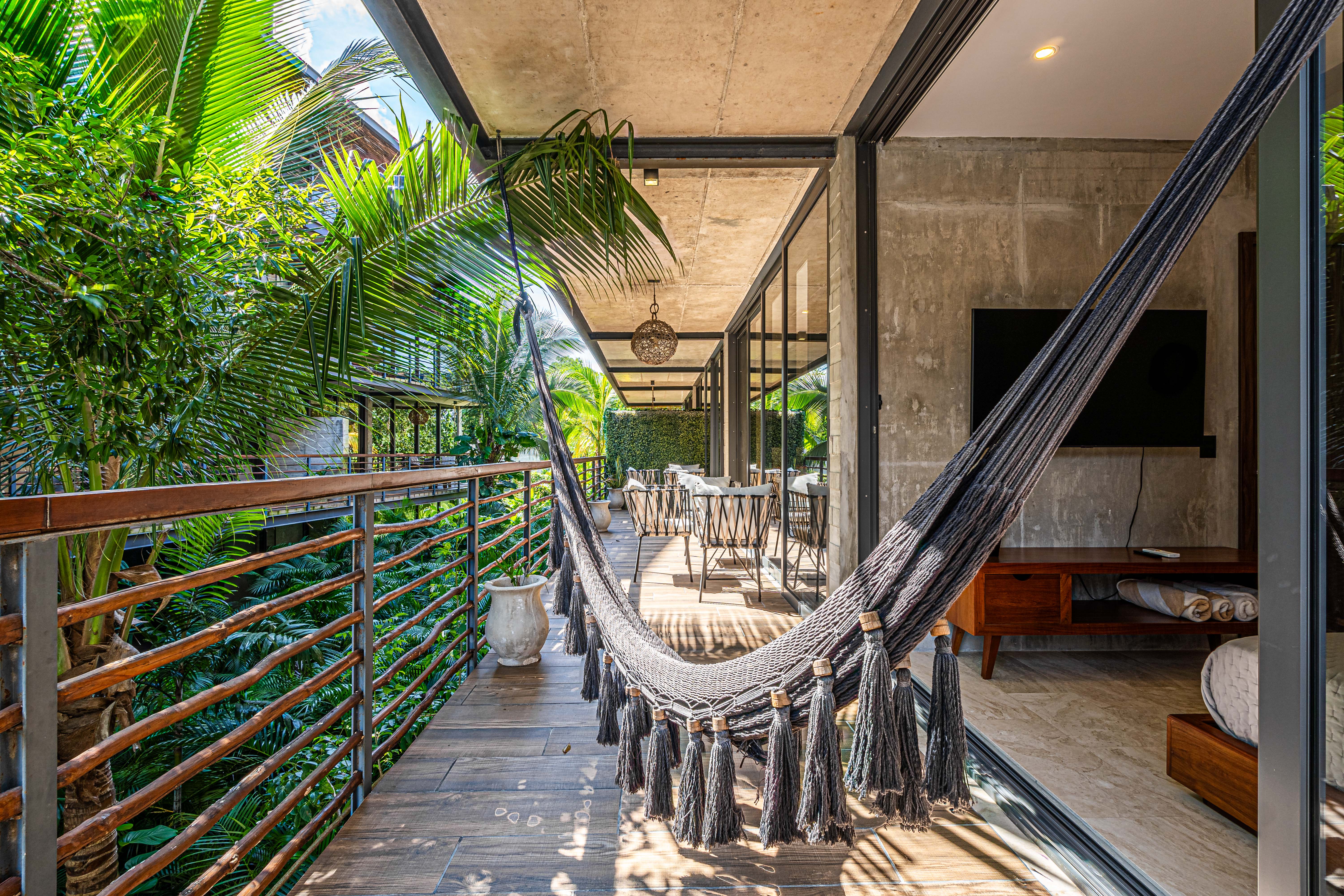 Hammock and seating on Xalet Tulum’s leafy private terrace